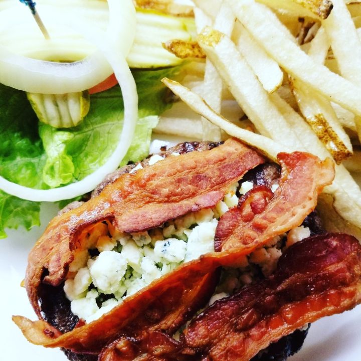 Big Bleu burger with blue cheese crumbles and crisp bacon at The Black Steer in Loveland, Colorado