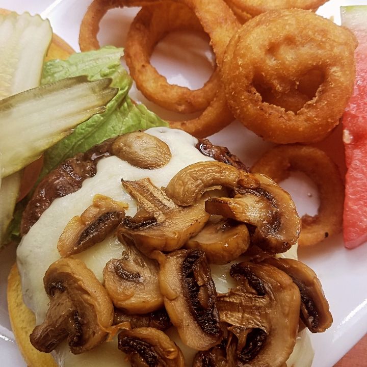Swiss mushroom burger topped with sautéed mushrooms and Swiss cheese at The Black Steer steakhouse in Loveland, Colorado